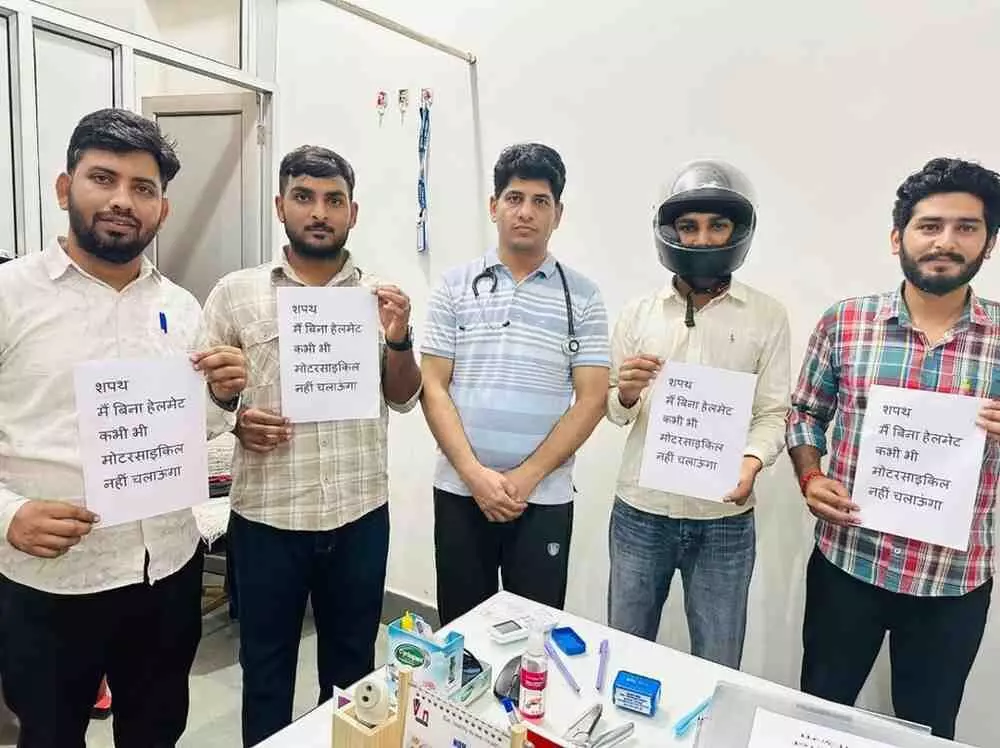 Dr. Hans Raj Sharmas clinic staff took the pledge to wear helmets