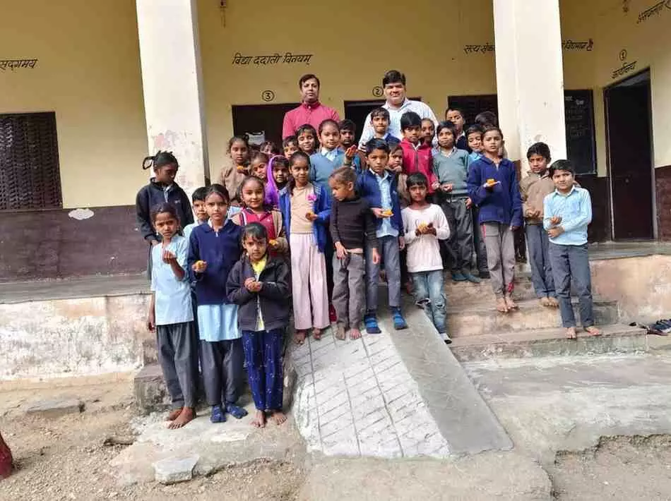 Distribution of laddus among the children in Government Primary School Distribution of laddus among the children in Government Primary School