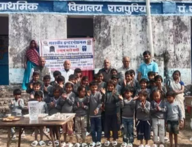 Mahavir International distributes sweaters and footwear to tribal