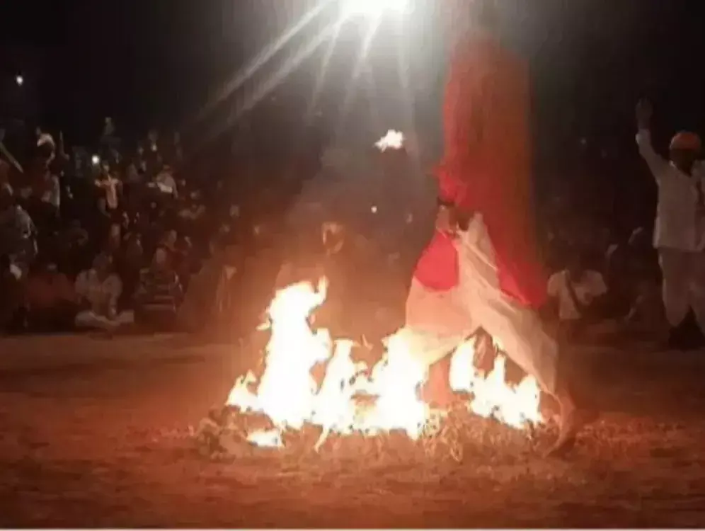 A dance of devotion on burning embers, a vibrant display of heroism in the desert soil A dance of devotion on burning embers, a vibrant display of heroism in the desert soil