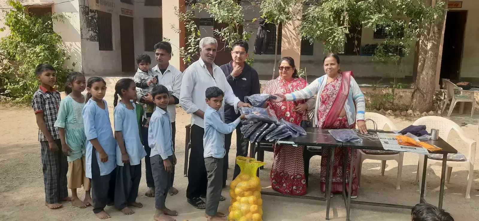 With the help of philanthropists, sweaters and food items were distributed to the students in Raidas Colony. With the help of philanthropists, sweaters and food items were distributed to the students in Raidas Colony.