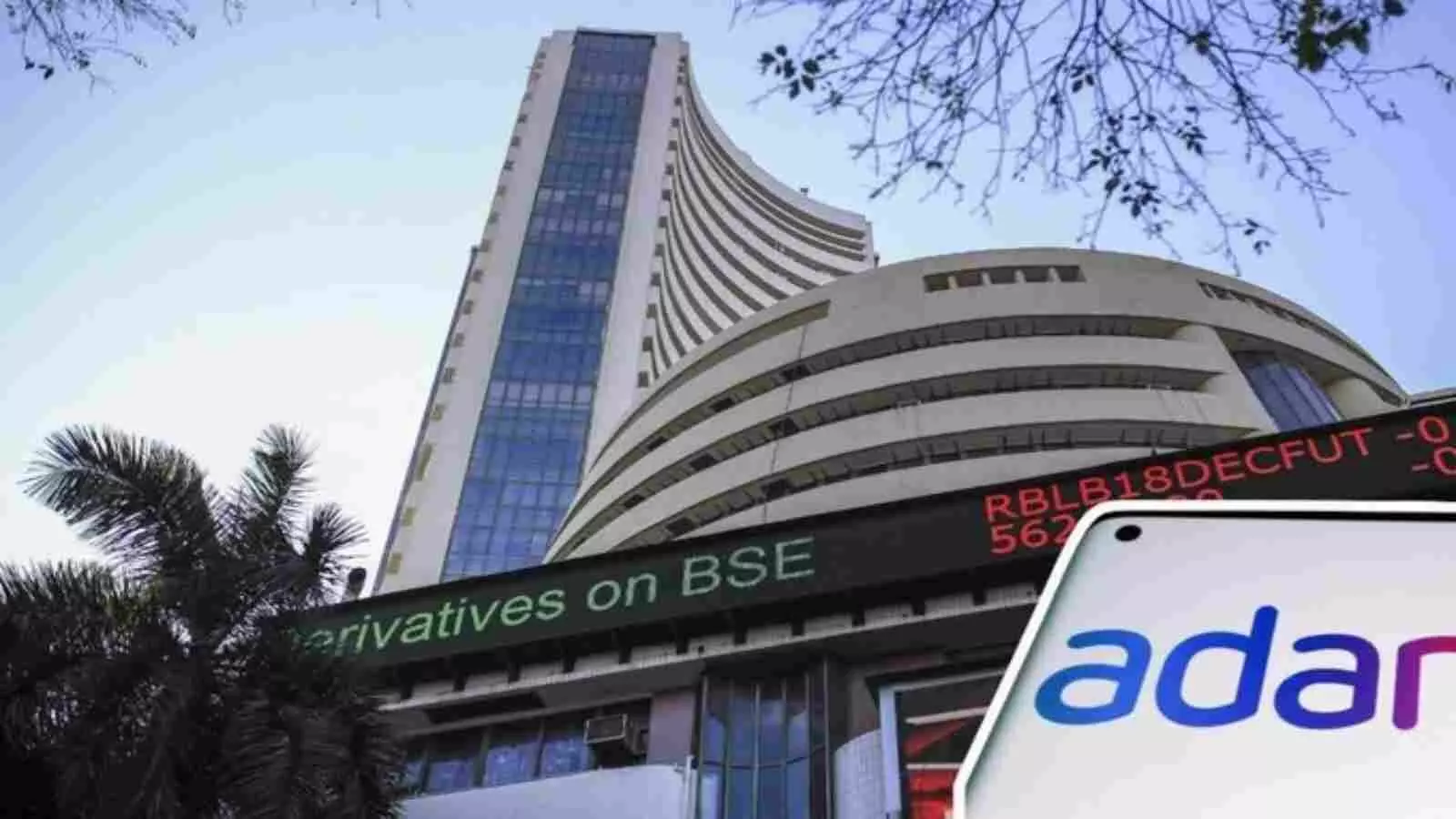 बॉम्बे स्टॉक एक्सचेंज की ऊंची इमारत और अदाणी समूह का लोगो शेयर बाजार में गिरावट के संदर्भ में बॉम्बे स्टॉक एक्सचेंज की ऊंची इमारत और अदाणी समूह का लोगो शेयर बाजार में गिरावट के संदर्भ में