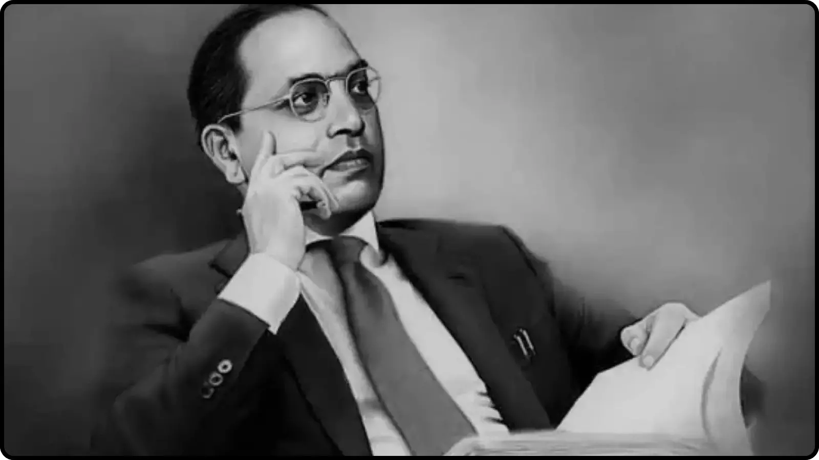डॉ. भीमराव अंबेडकर का चश्मा पहने हुए और हाथ में पुस्तक लिए एक औपचारिक चित्र।