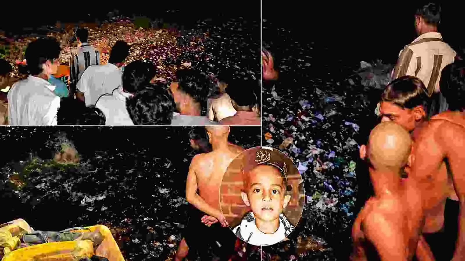 गाजियाबाद के लोनी में कूड़े से भरे तालाब के पास रेस्क्यू ऑपरेशन देखते स्थानीय लोग।