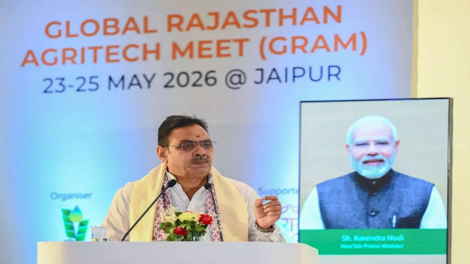 नई दिल्ली में ग्राम-2026 इन्वेस्टर मीट के दौरान पोडियम पर भाषण देते मुख्यमंत्री भजनलाल शर्मा। नई दिल्ली में ग्राम-2026 इन्वेस्टर मीट के दौरान पोडियम पर भाषण देते मुख्यमंत्री भजनलाल शर्मा।