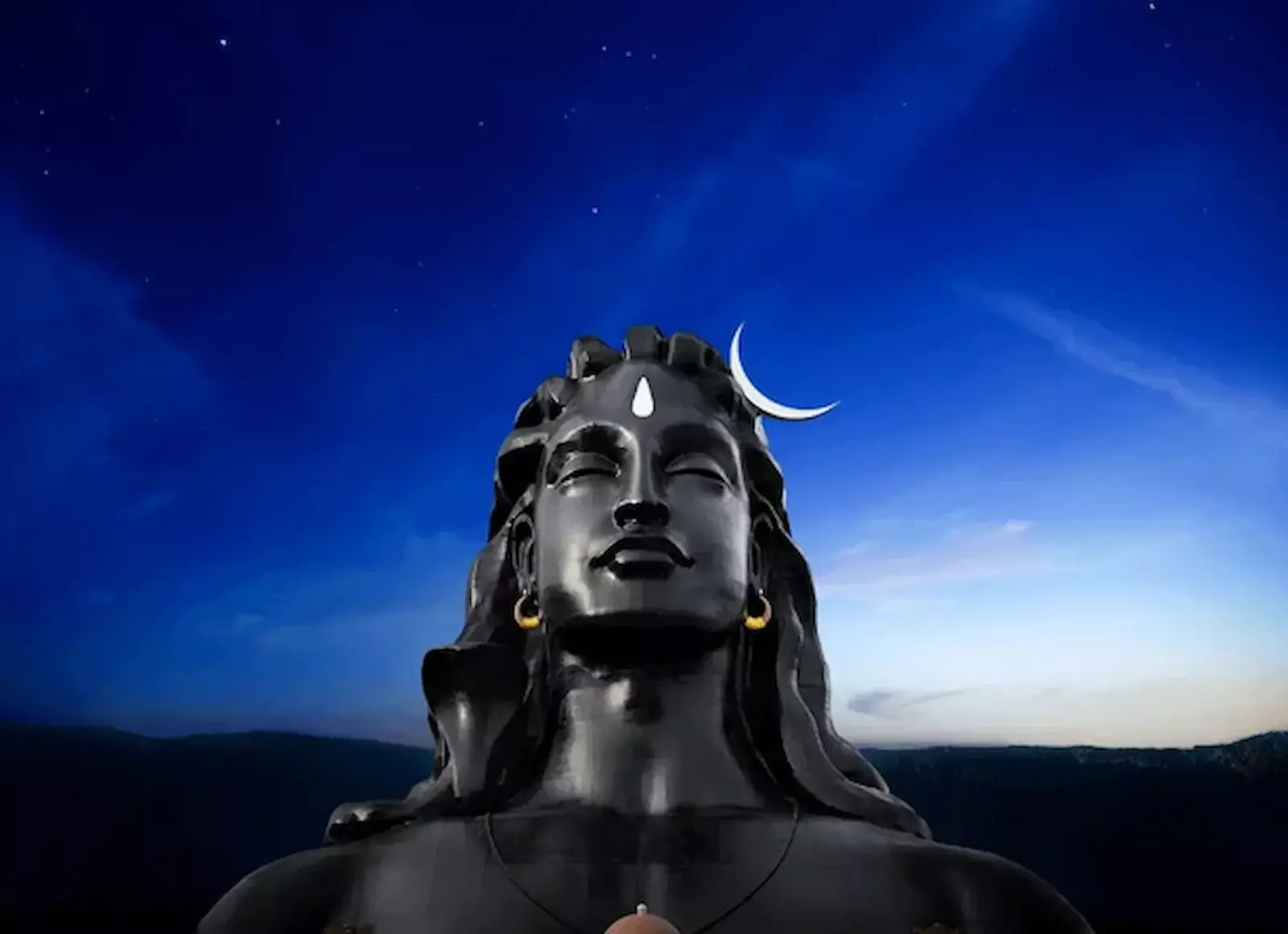 पर्वत पर ध्यान मुद्रा में बैठे भगवान शिव और जटाओं से बहती गंगा का प्रतीकात्मक चित्रण। पर्वत पर ध्यान मुद्रा में बैठे भगवान शिव और जटाओं से बहती गंगा का प्रतीकात्मक चित्रण।