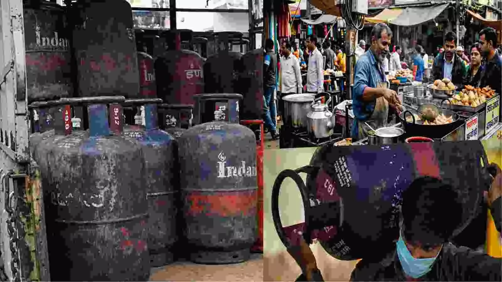 ट्रक में रखे कमर्शियल गैस सिलेंडर और कंधे पर सिलेंडर ले जाता हुआ व्यक्ति|
