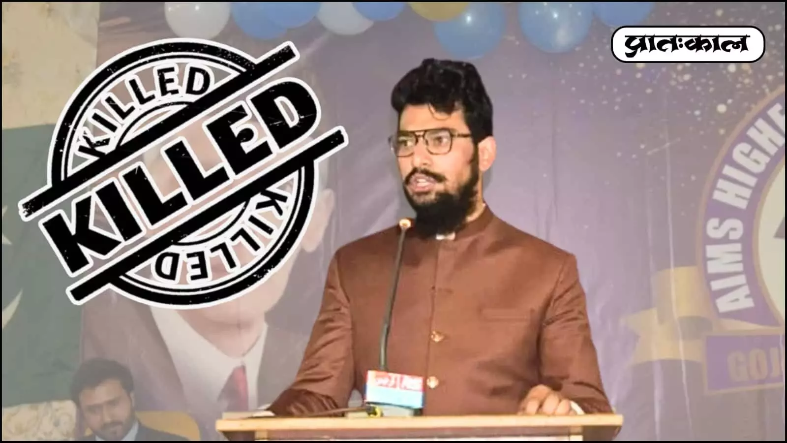 पोडियम के पीछे खड़े होकर चश्मा और भूरे रंग का कुर्ता पहने भाषण देता हुआ आतंकी हमजा बुरहान। पोडियम के पीछे खड़े होकर चश्मा और भूरे रंग का कुर्ता पहने भाषण देता हुआ आतंकी हमजा बुरहान।
