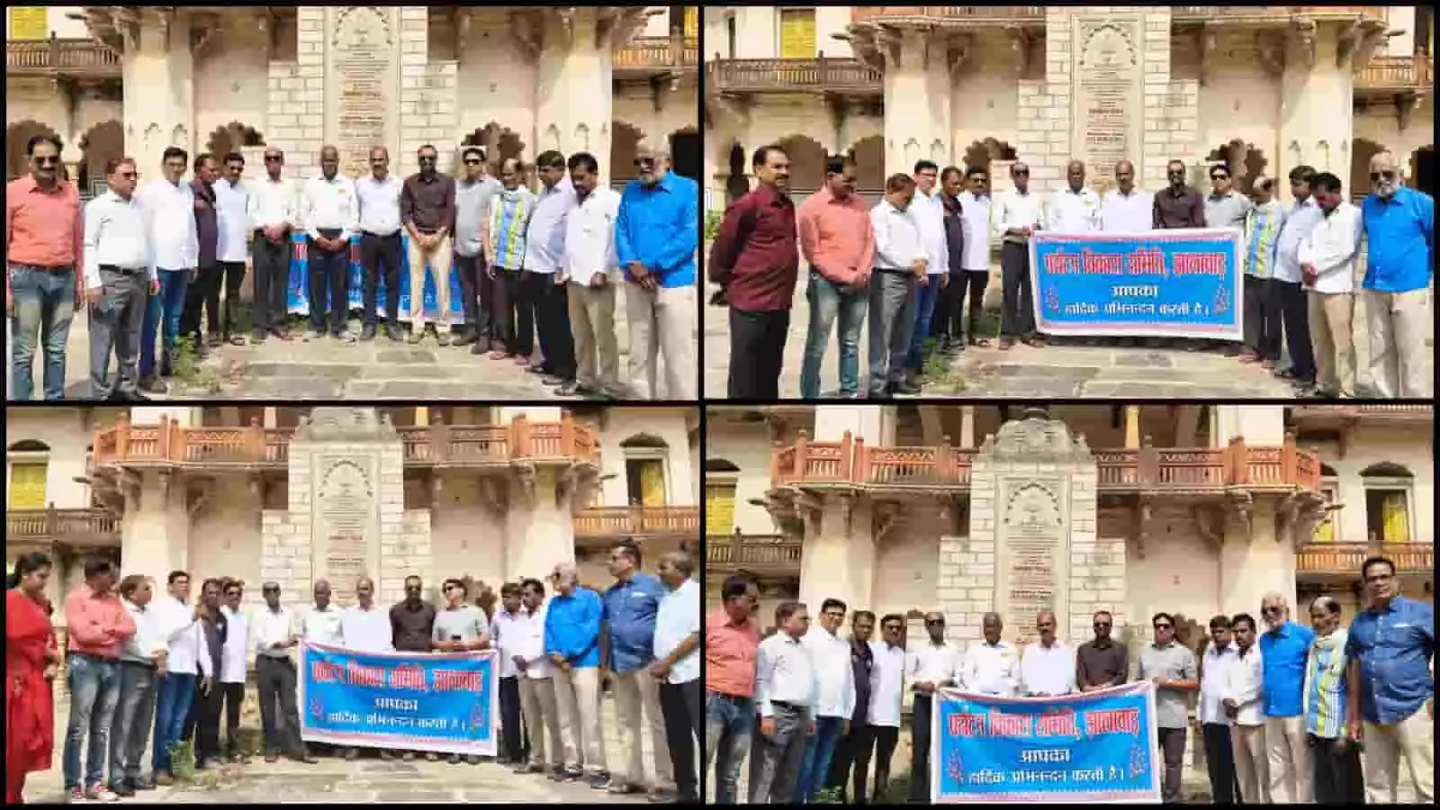 भवानी नाट्यशाला परिसर में पर्यटन विकास समिति के बैनर के साथ खड़े लोग।