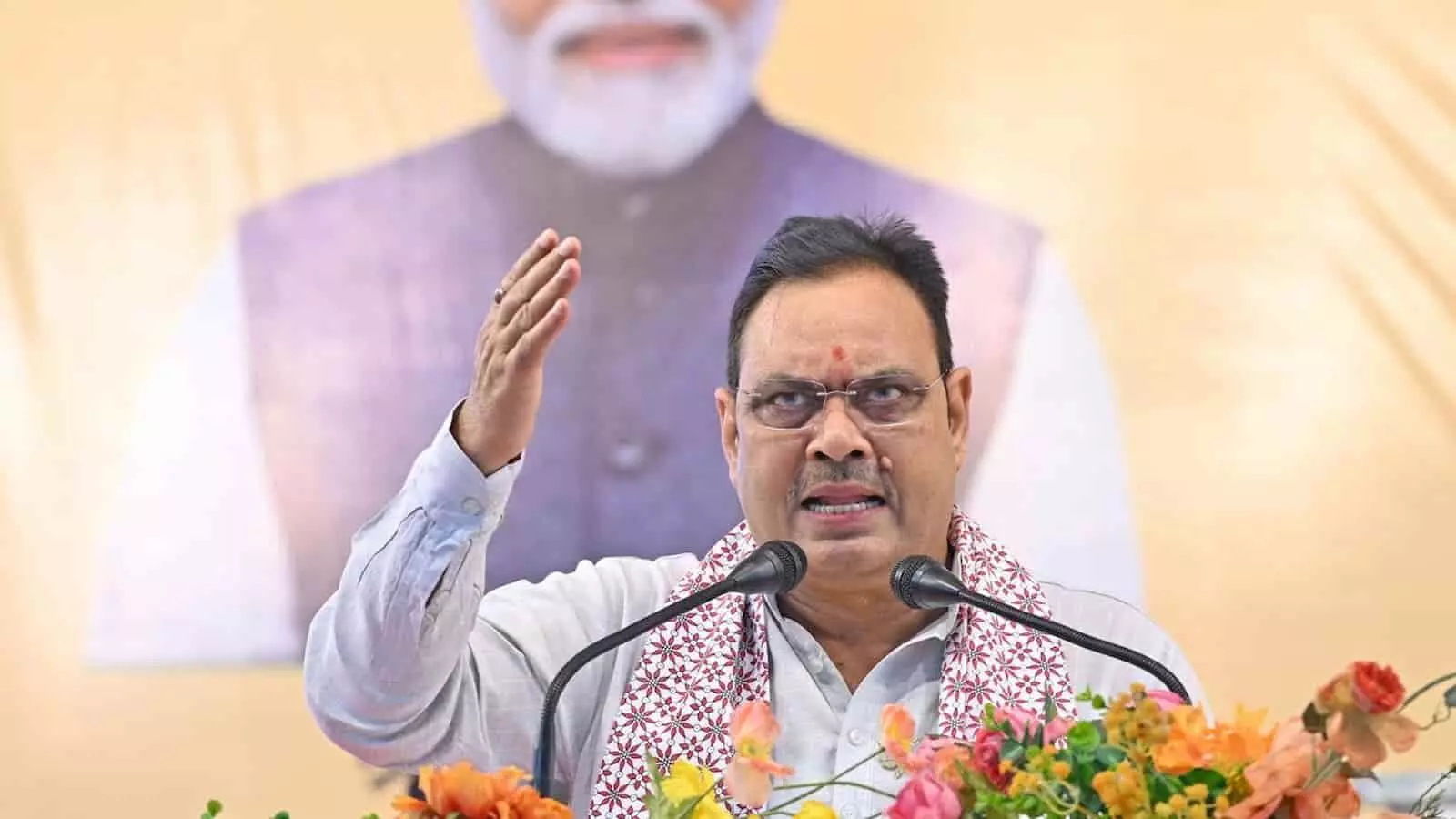 तस्वीर में मुख्यमंत्री भजनलाल शर्मा पोडियम से संबोधित कर रहे हैं और पीछे बैनर पर प्रधानमंत्री नरेंद्र मोदी की तस्वीर दिख रही है। तस्वीर में मुख्यमंत्री भजनलाल शर्मा पोडियम से संबोधित कर रहे हैं और पीछे बैनर पर प्रधानमंत्री नरेंद्र मोदी की तस्वीर दिख रही है।