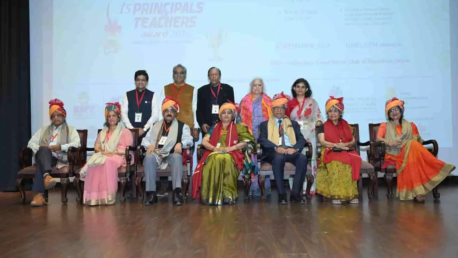 तस्वीर में कॉन्स्टिट्यूशन क्लब जयपुर में प्रिंसिपल्स एंड टीचर्स अवॉर्ड 2026 समारोह के दौरान सम्मानित शिक्षक और अतिथि बैठे दिखाई दे रहे हैं। तस्वीर में कॉन्स्टिट्यूशन क्लब जयपुर में प्रिंसिपल्स एंड टीचर्स अवॉर्ड 2026 समारोह के दौरान सम्मानित शिक्षक और अतिथि बैठे दिखाई दे रहे हैं।